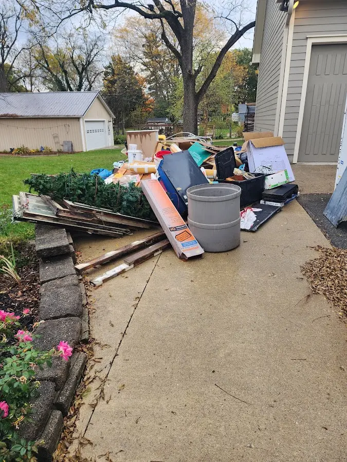 Dumpster being loaded with debris for 30 Yard Dumpster Rental in Lake Station